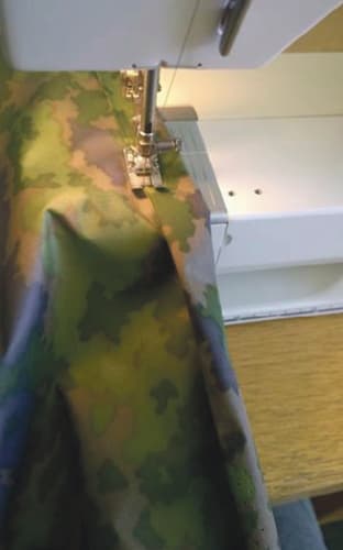 Sadeviitan sivujen ompelu