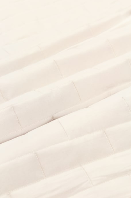 LINNAN MUURILLA -tikki vaaleabeige